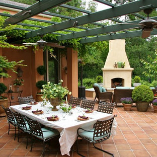 Tuscan patio photo in Sacramento with a fire pit and a pergola