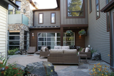 Patio - mid-sized contemporary courtyard concrete paver patio idea in Denver with a fire pit and no cover
