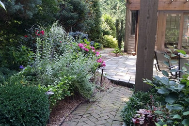 Mid-sized elegant backyard brick patio photo in Philadelphia with no cover