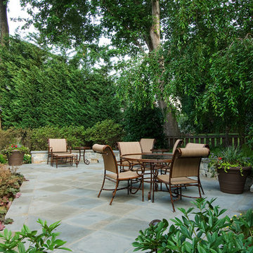 Back Patio surrounded by stone seat wall