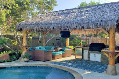 Mid-sized island style backyard patio photo in Houston