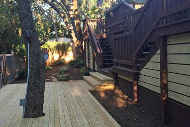 Mid-sized trendy backyard patio photo in Austin with decking and no cover