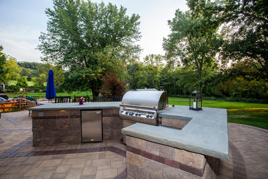 Patio kitchen - large contemporary backyard concrete paver patio kitchen idea in Philadelphia with no cover