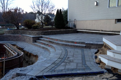 Photo of a classic back patio in Boston with concrete paving.