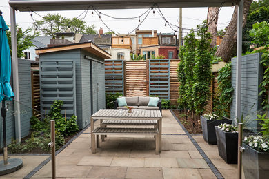 Patio - contemporary backyard stone patio idea in Toronto with no cover