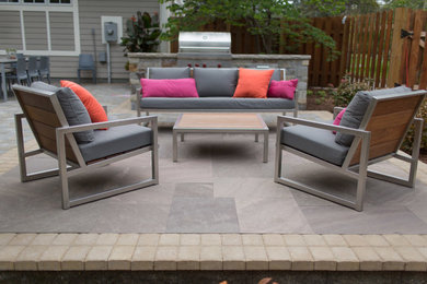 Inspiration for a mid-sized transitional backyard concrete paver patio remodel in Minneapolis with no cover