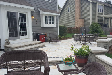 Mid-sized elegant backyard brick patio kitchen photo in Chicago with no cover