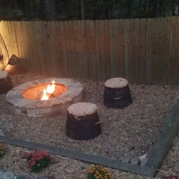 Backyard firepit and stone pathway
