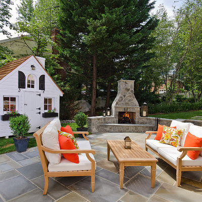 Inspiration for a timeless patio remodel in DC Metro with no cover and a fireplace