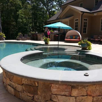 Backyard patio, pool, and hot tub.
