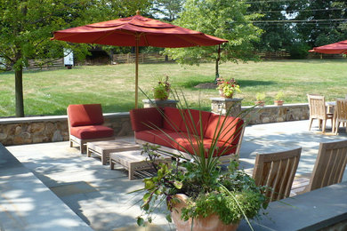 Patio - large traditional backyard stone patio idea in Baltimore