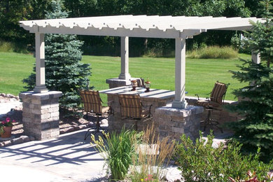Example of a mid-sized classic patio design in Other