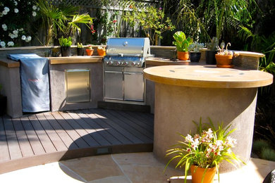 Patio kitchen - mid-sized transitional backyard stone patio kitchen idea in San Francisco with no cover
