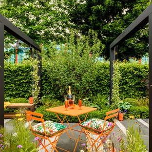 Inspiration for a contemporary patio in West Midlands with concrete slabs.
