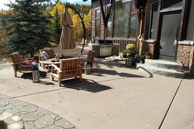 Inspiration for a modern patio in Denver with brick paving.