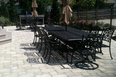 Photo of a beach style patio in New York.