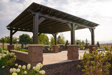 Traditional back patio in Boise with a pergola.