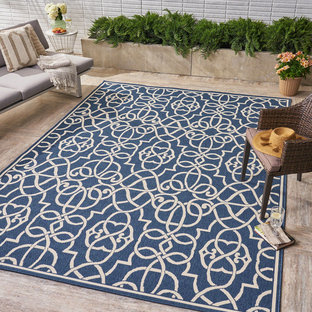 Immagine di un patio o portico chic di medie dimensioni