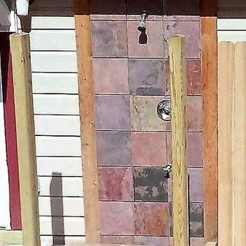 Beginnings of an outdoor shower featuring slate tiles