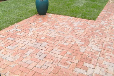 Patio - mid-sized transitional backyard brick patio idea in Chicago with no cover