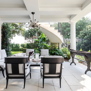 Inspiration for a large mediterranean patio in Sydney with concrete pavers and a roof extension.