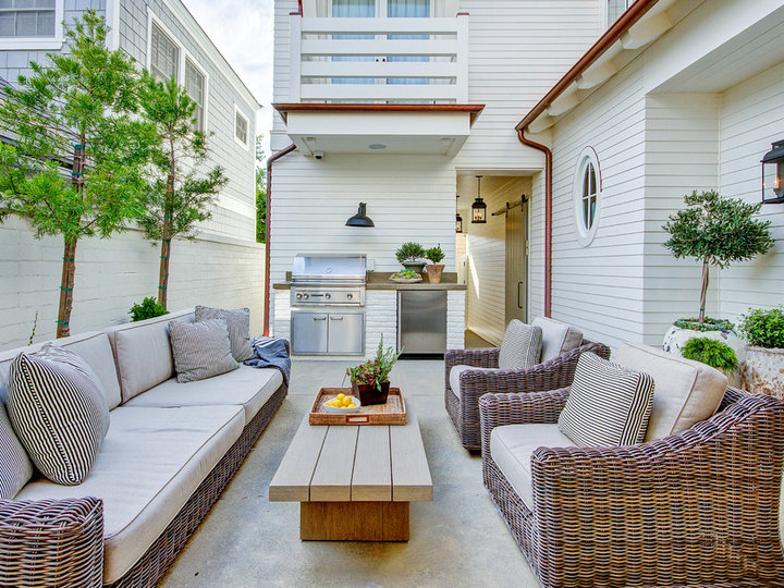 Mid-sized cottage backyard concrete paver patio kitchen photo with no cover