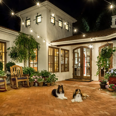 Patio - large mediterranean courtyard brick patio idea in San Francisco with no cover
