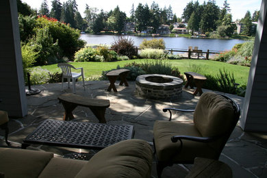 Patio - large contemporary patio idea in Seattle