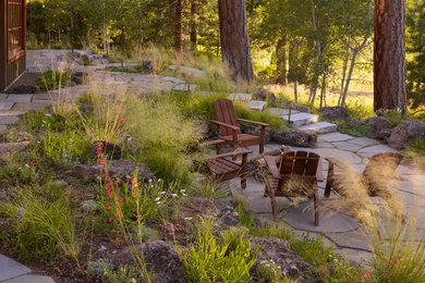 Inspiration for a timeless backyard stone patio remodel in Portland