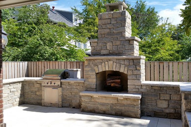 Mid-sized trendy backyard concrete patio photo in Other with a fire pit and no cover