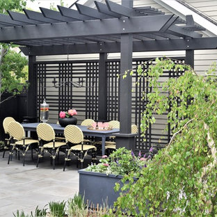 Inspiration for a small contemporary backyard stone patio remodel in Chicago with a fire pit and a pergola