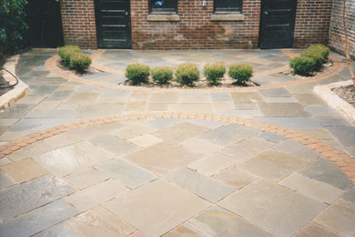 Bluestone patio with brick inlay