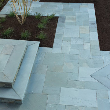 Bluestone Terraces, Porches, walkway and Plantings By Garden Artisans LLC