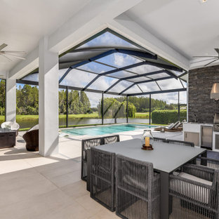 Example of a transitional patio design in Tampa