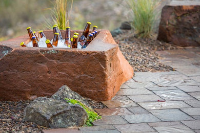 Inspiration for a mid-sized rustic backyard brick patio remodel in Denver with a fire pit and no cover