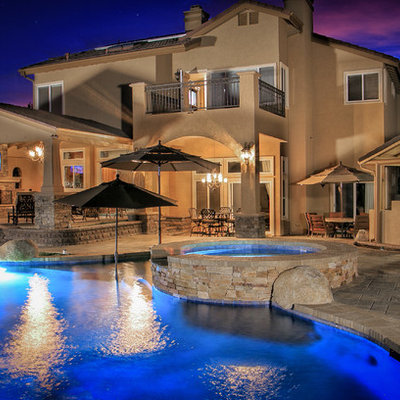 Patio kitchen - large traditional backyard concrete paver patio kitchen idea in San Diego with a pergola