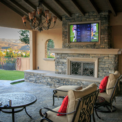 Inspiration for a large timeless backyard concrete paver patio kitchen remodel in San Diego with a pergola