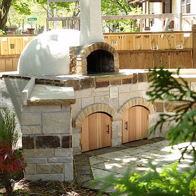 Inspiration for a mid-sized southwestern backyard concrete paver patio kitchen remodel in Portland