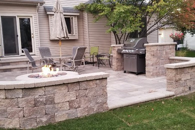 Inspiration for a modern back patio in Chicago with brick paving and no cover.
