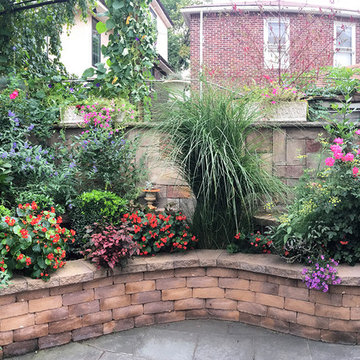 Brooklyn Garden with Retaining Walls, Outdoor Kitchen & Lush Plantings