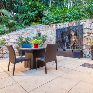 Idee per un patio o portico etnico con nessuna copertura