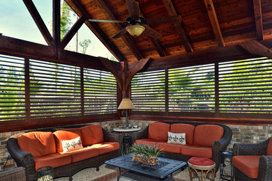 Patio - large transitional backyard stone patio idea in Orange County with a gazebo