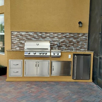 Built-in outdoor bbq kitchen with mosaic backsplash