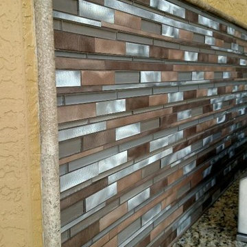 Built-in outdoor bbq kitchen with mosaic backsplash