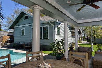 Diseño de patio de estilo americano de tamaño medio en patio trasero y anexo de casas con losas de hormigón