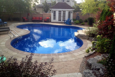 Inspiration for a transitional pool remodel in Toronto