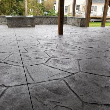C-Stamped concrete patio with a wall