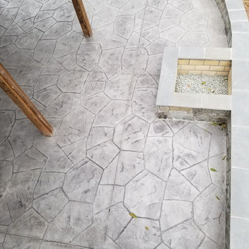 C-Stamped concrete patio with a wall