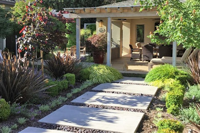 Minimalist backyard stamped concrete patio photo in San Francisco with a fire pit and a gazebo