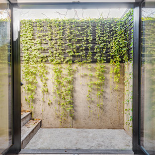 Idee per un patio o portico industriale di medie dimensioni